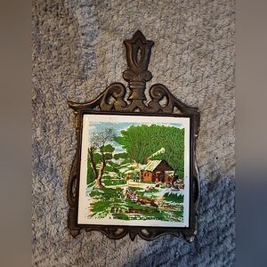Vintage Cast Iron And Ceramic Wall Art Trivet with Cabin Scene